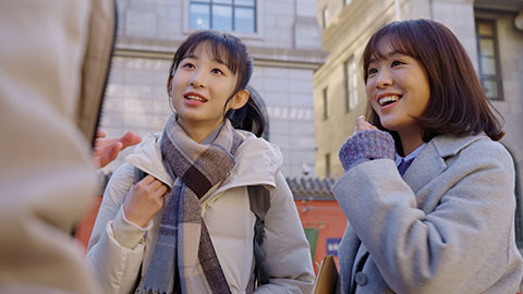 Happy Chinese college students chatting