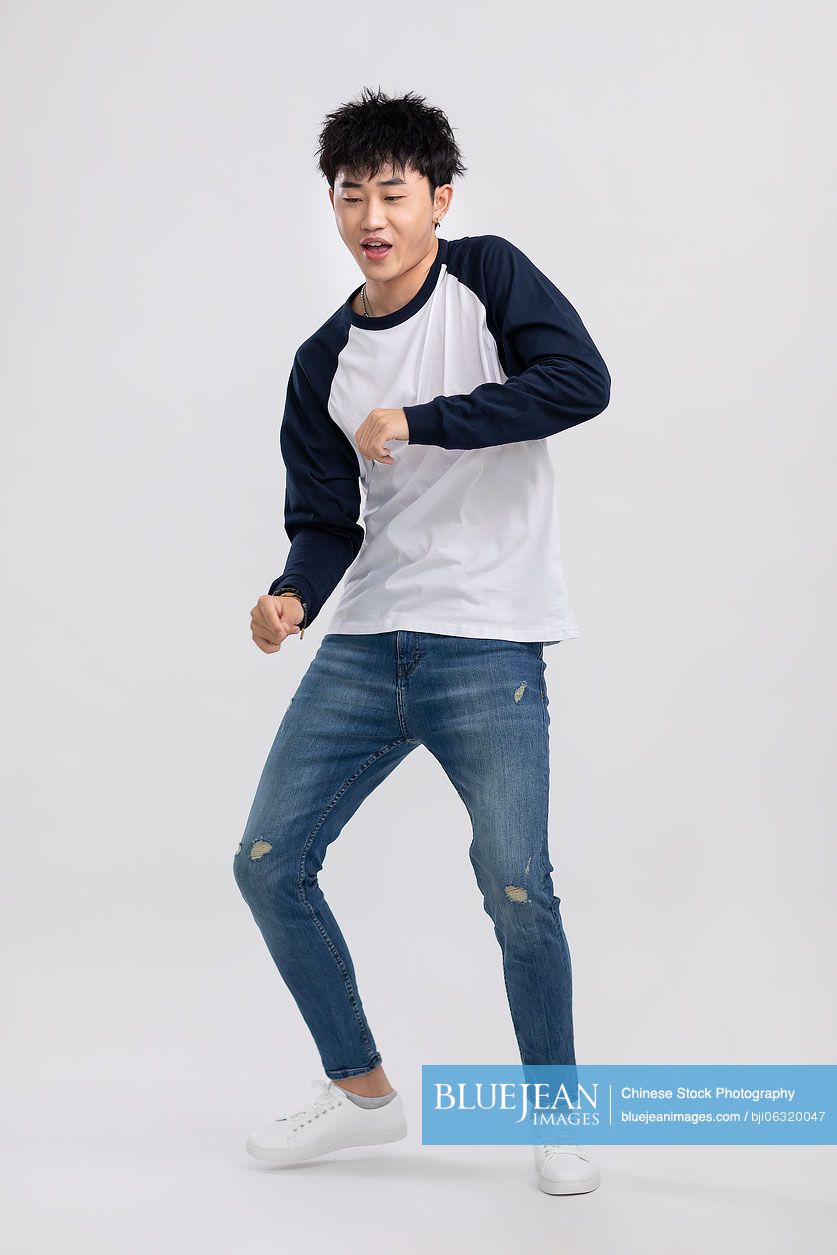 Cool young Chinese man dancing