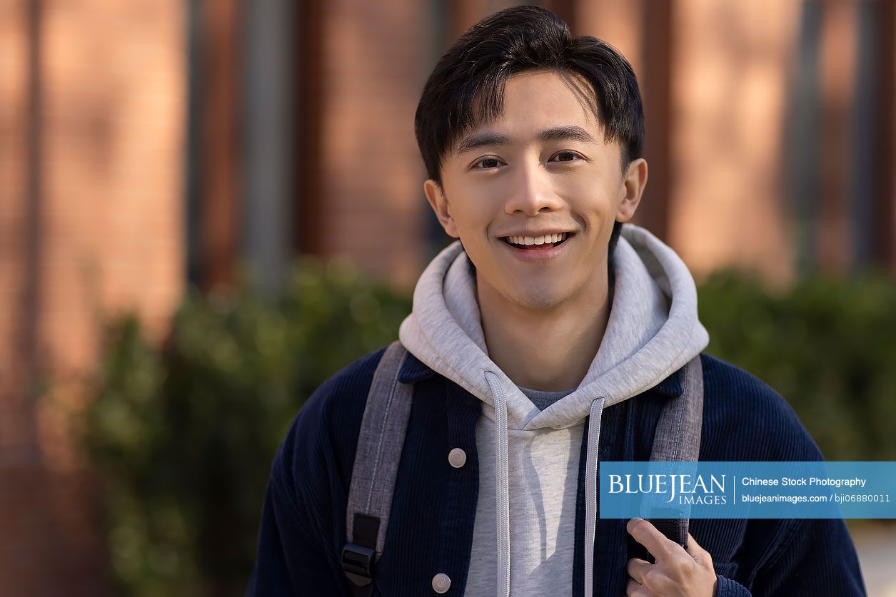 Portrait of cheerful Chinese college student