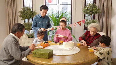 Family celebrating birthday with joy and laughter