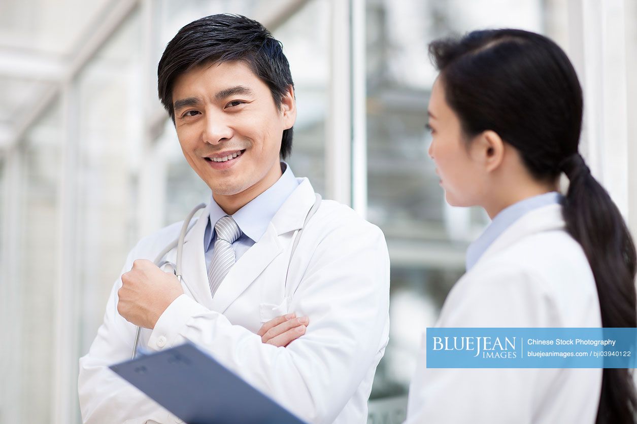 Happy Chinese doctors smiling