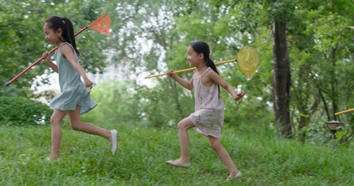 Three Chinese children playing on grass,4K