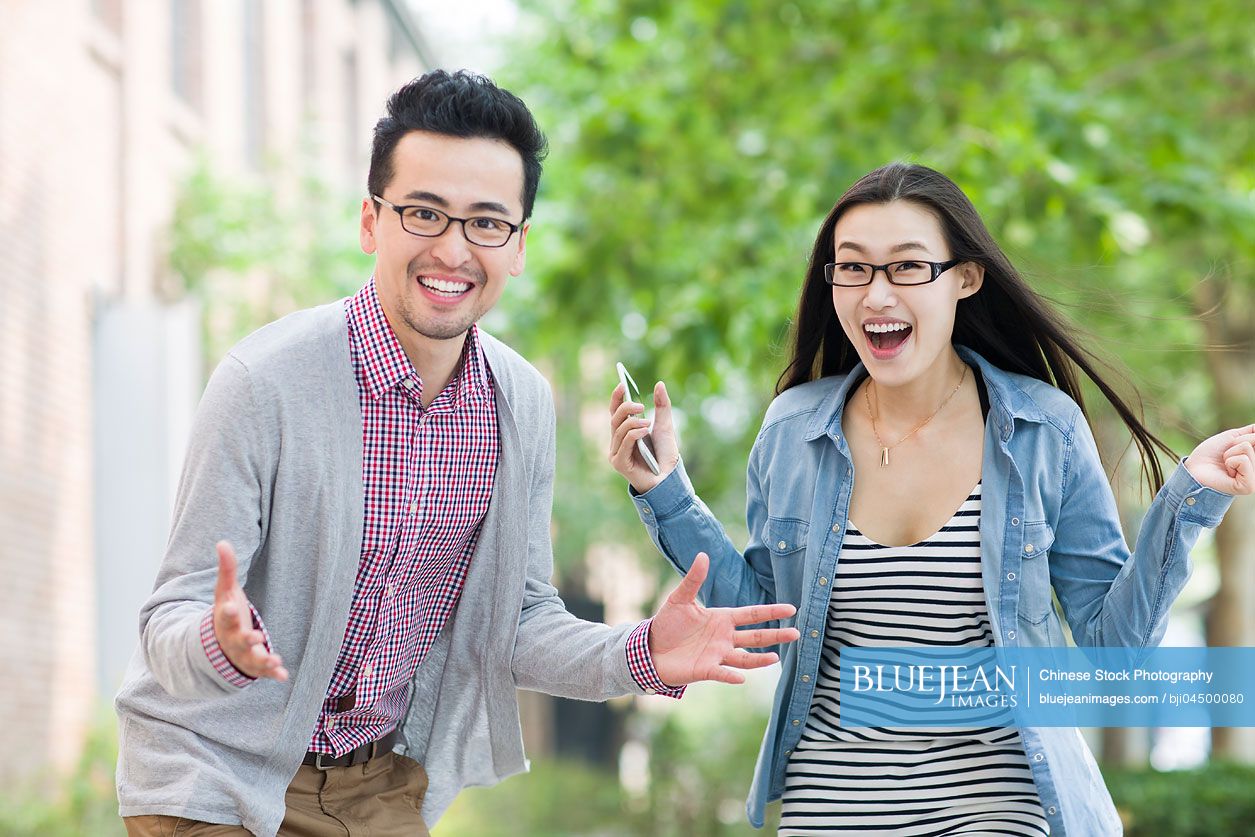 Happy Chinese business partners in cultural industry