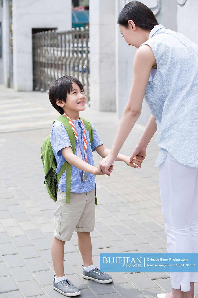 Chinese mother picking her son up from school