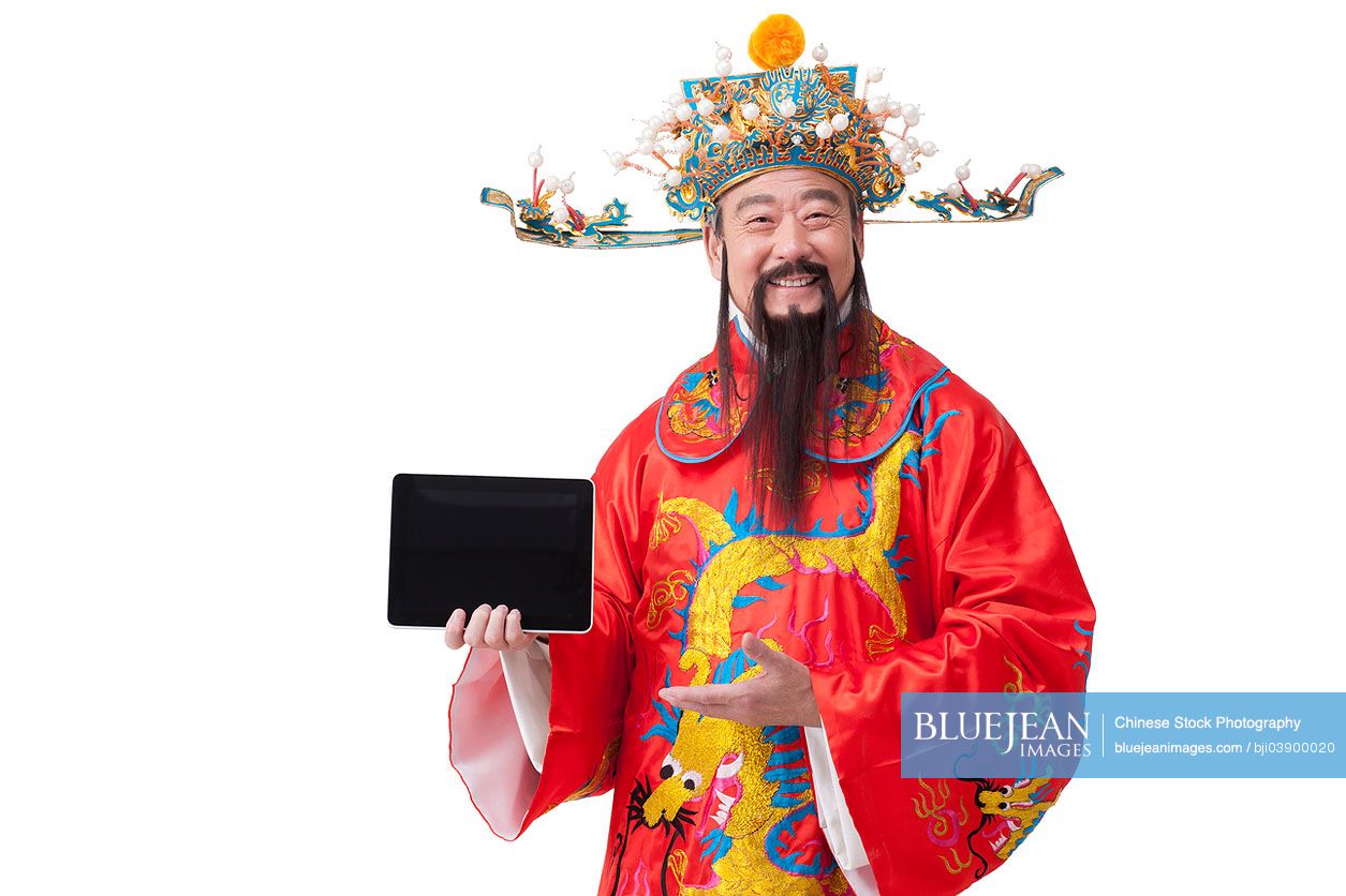 Chinese God of Wealth with digital tablet