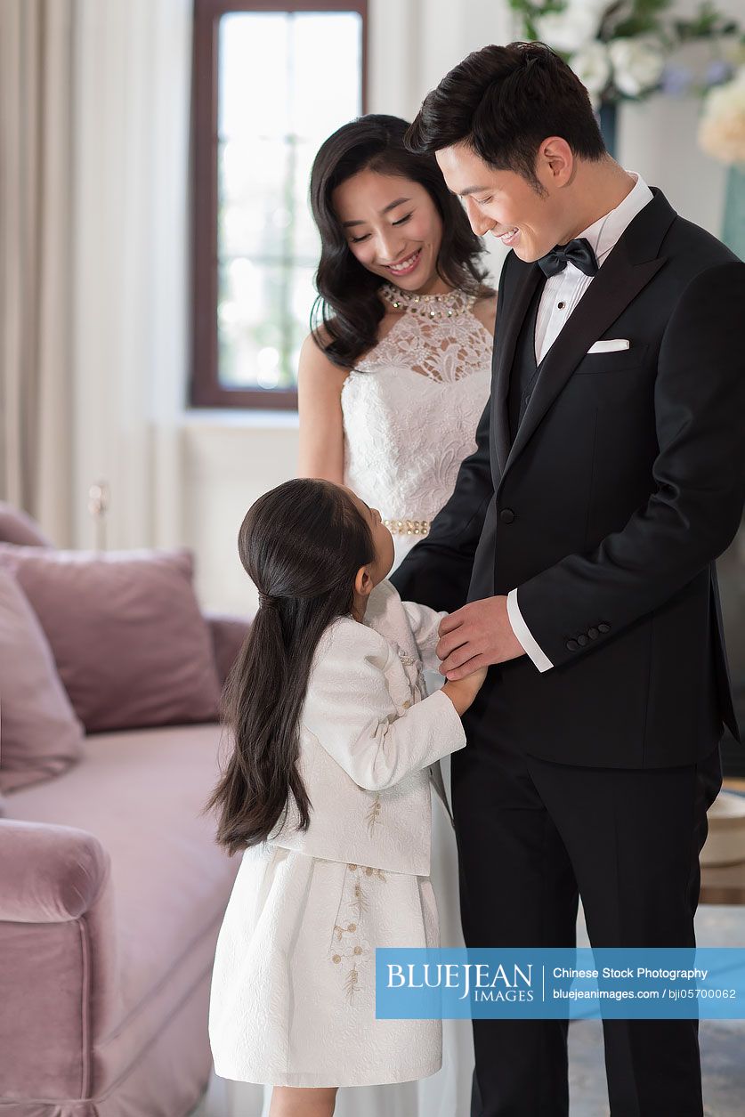 Happy noble young Chinese family
