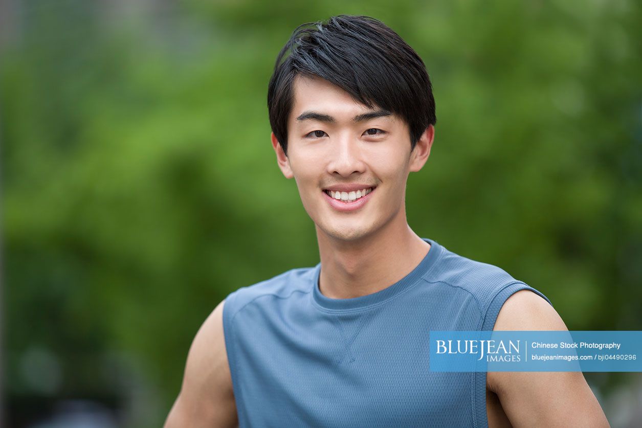 Young Chinese man doing exercise outside