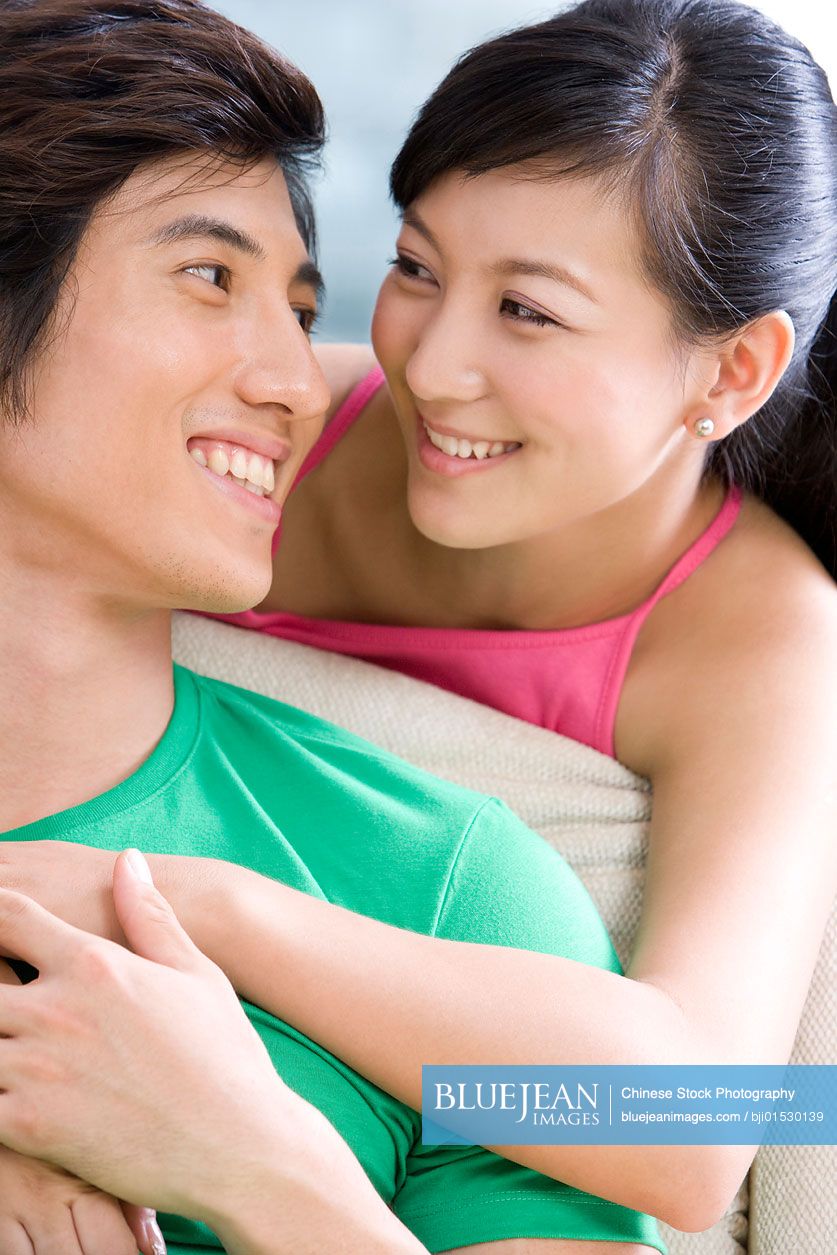 Chinese couple holding each other