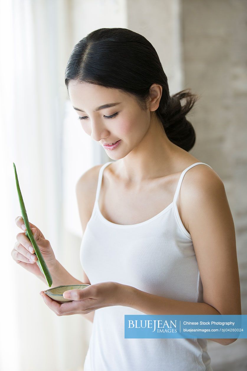 Young Chinese woman with natural aloe vera