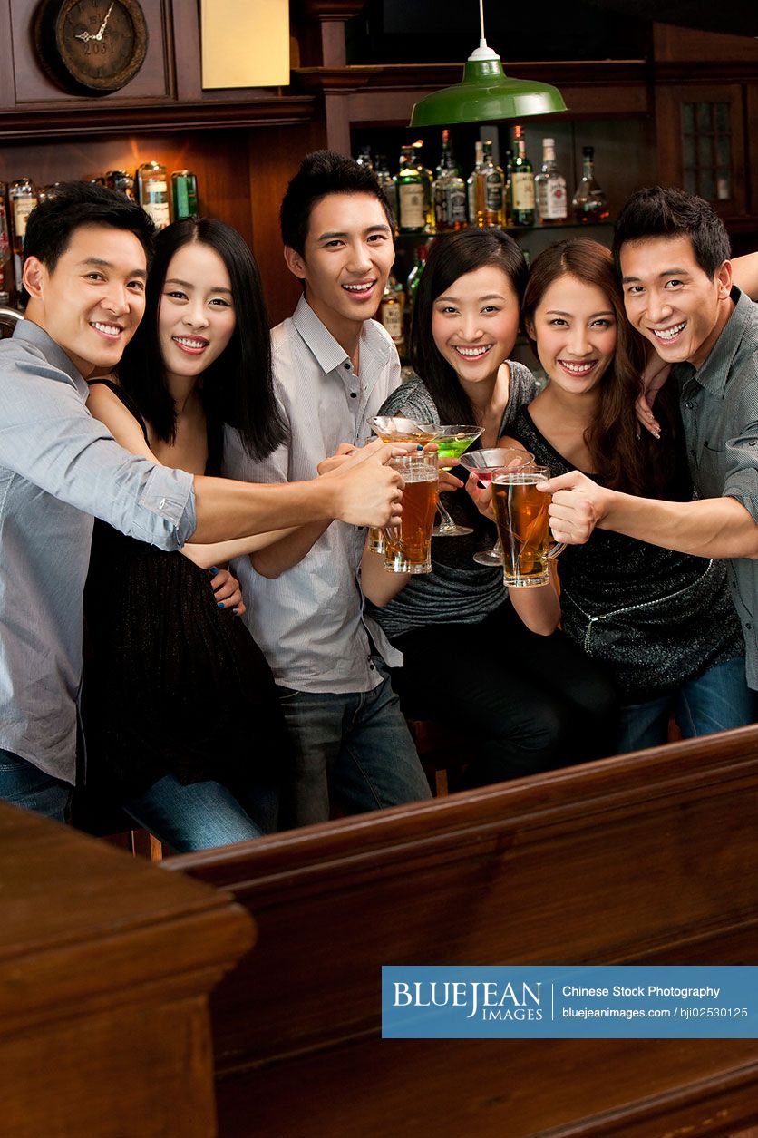 Chinese friends relaxing at a bar