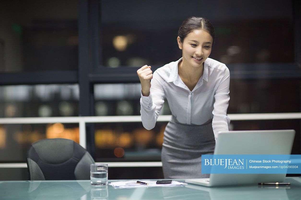 Young chinese businesswoman working in office high res stock photo for