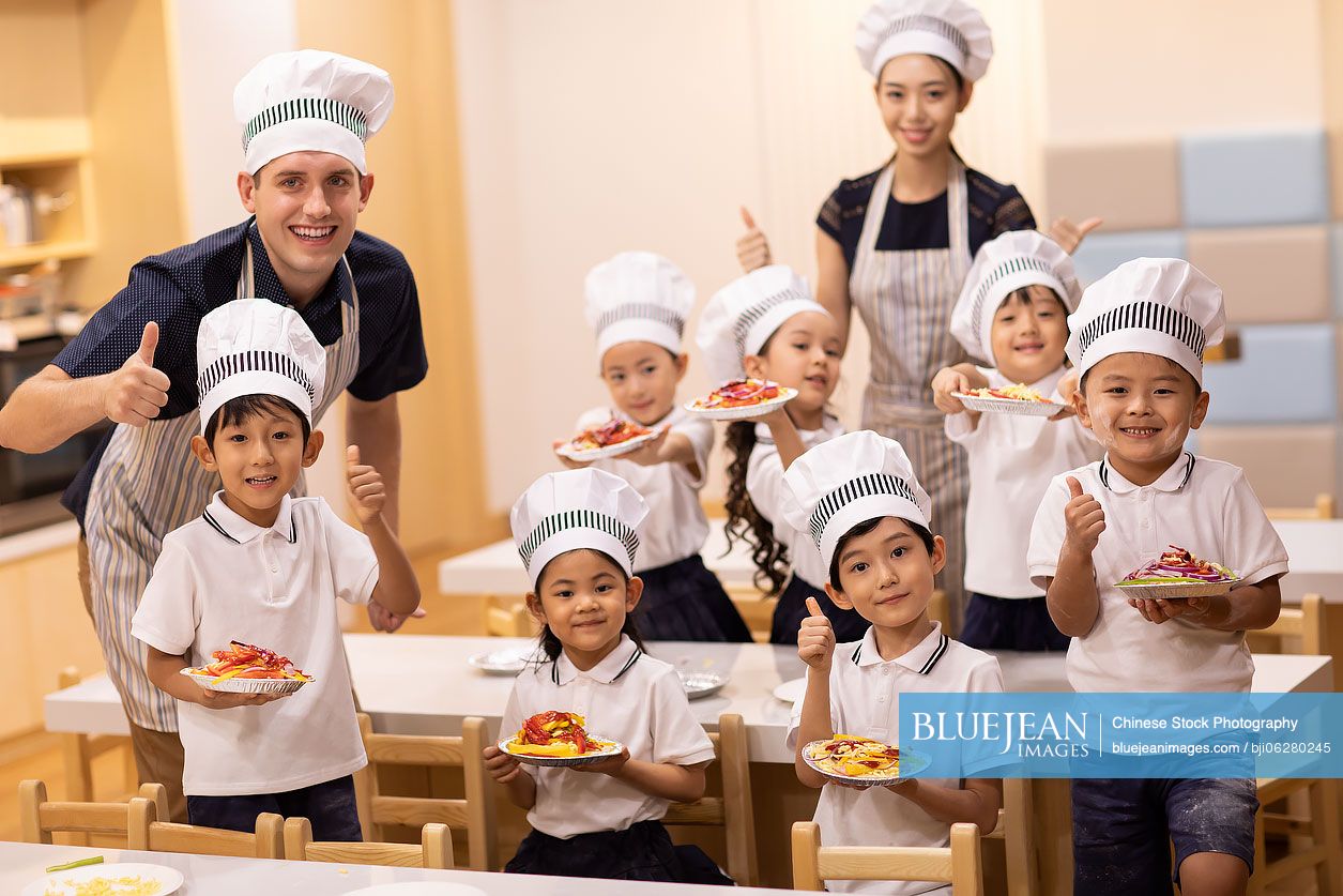 Children learning cooking in classroom