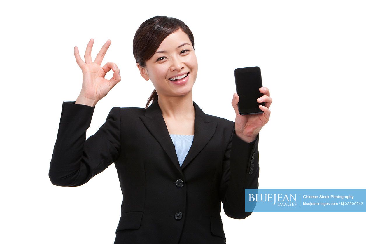 Chinese businesswoman showing mobile phone