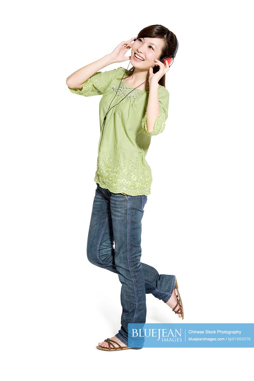 Portrait of young Chinese woman with headphones
