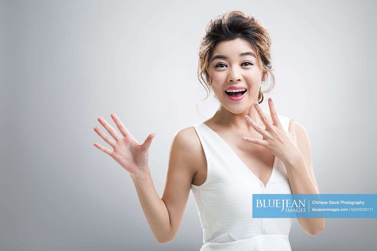 Portrait of happy young Chinese woman