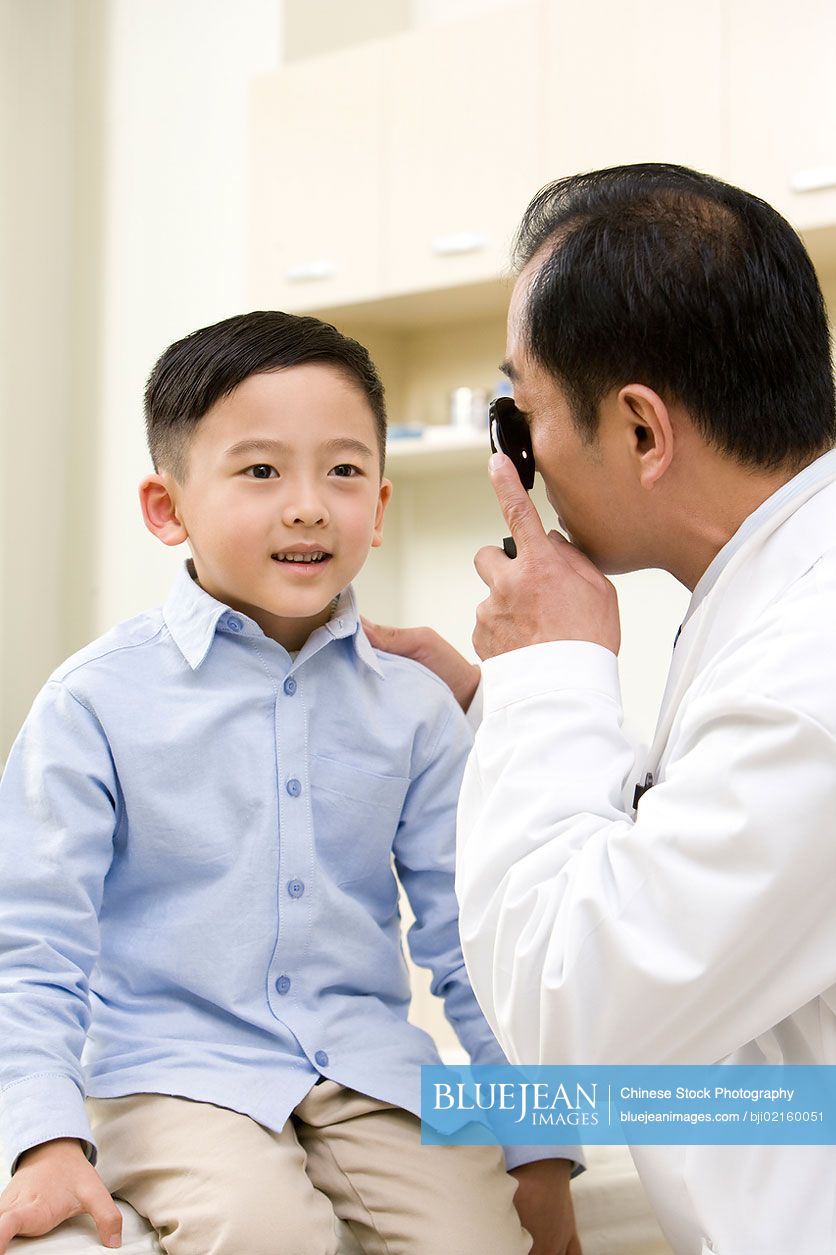 Young Chinese Boy Examined By A Doctor-High-res Stock Photo For Download