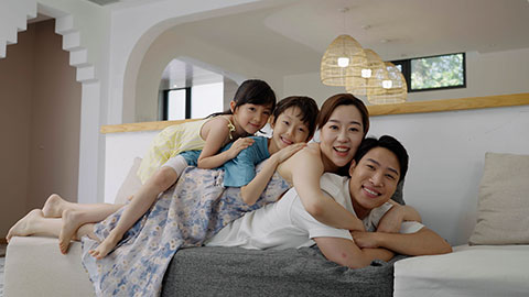 The family is enjoying their vacation and having fun at the hotel