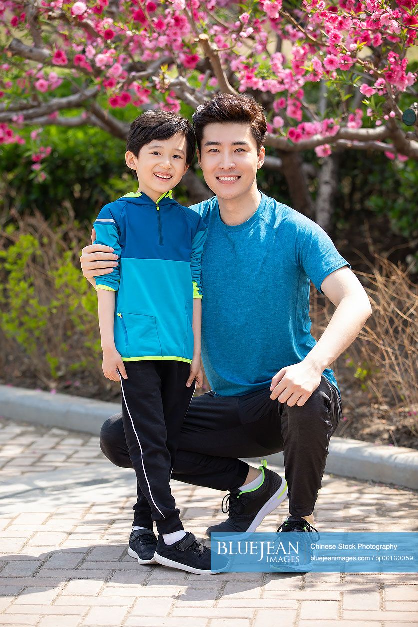 Chinese father and son in park