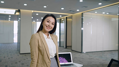 Chinese businesswoman thinking in empty office