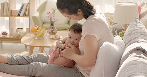 Young Chinese mom holding baby girl,4K