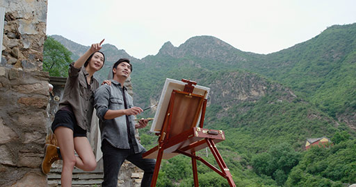 Young Chinese couple painting outdoors,4K