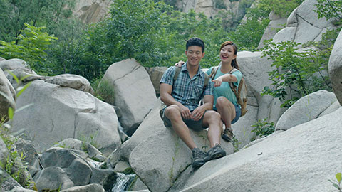 Happy young Chinese couple hiking outdoors,4K