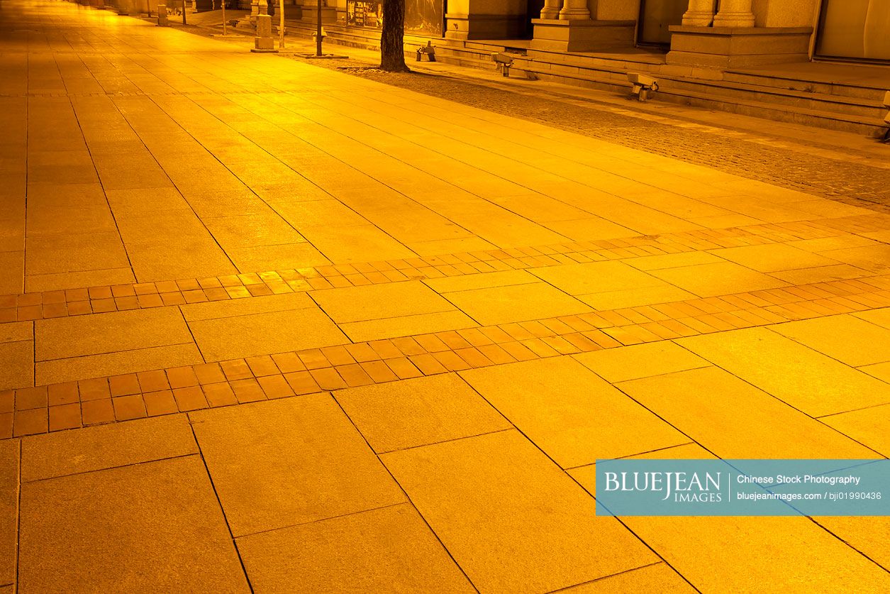 Sidewalk under the dim streetlights