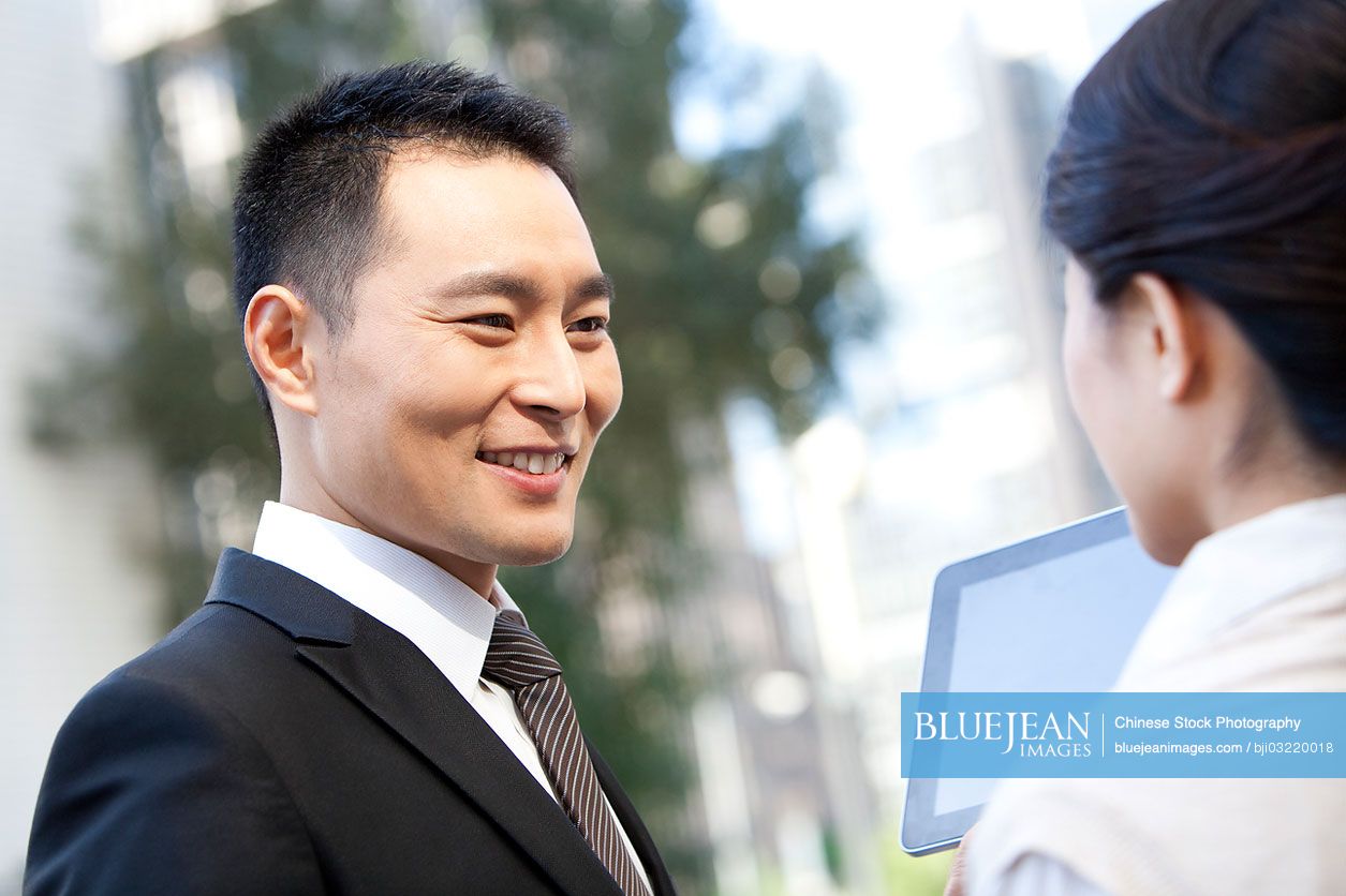 Chinese Business Coworkers With Digital Tablet High res Stock Photo For chinese-business-coworkers-with-digital-tablet-high-res-stock-photo-for