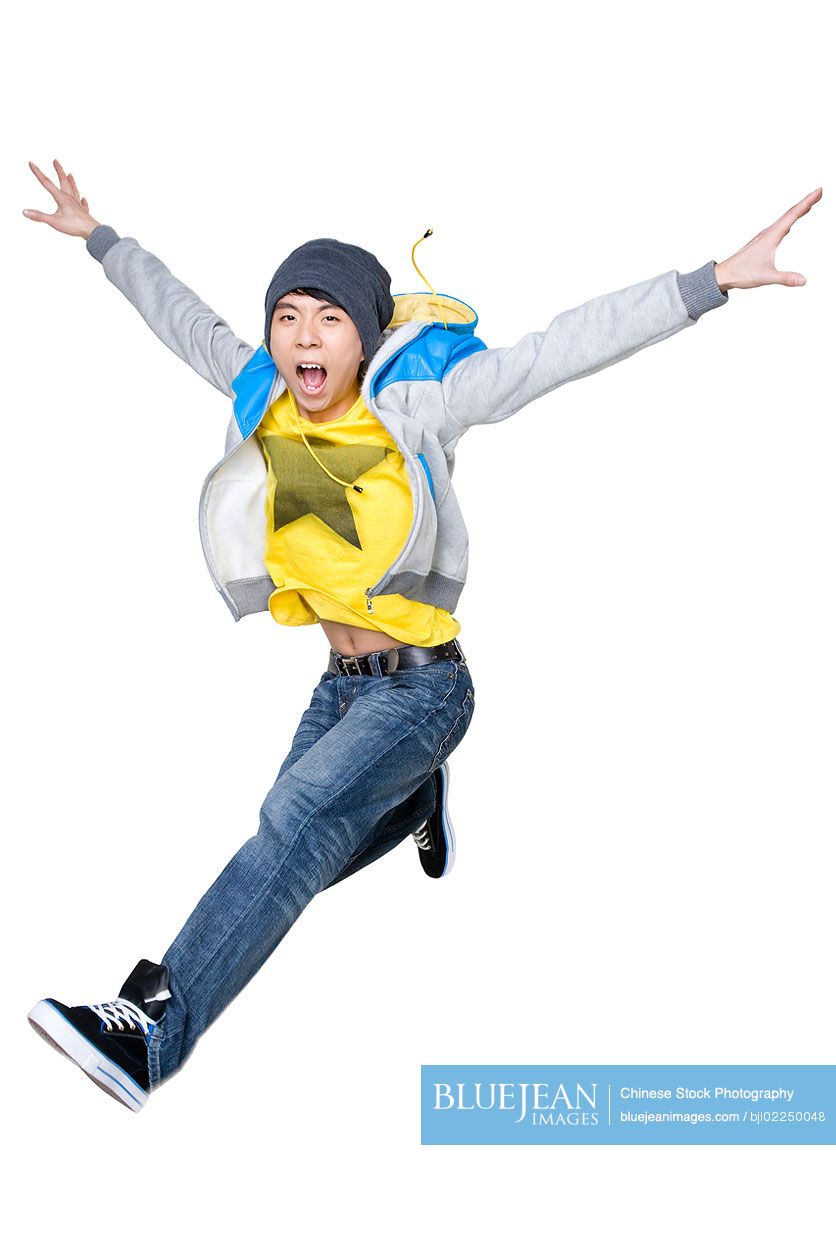 Excited Chinese man jumping in the air