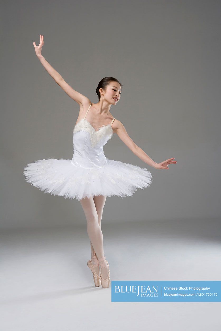 Chinese ballerina performing in a white tutu