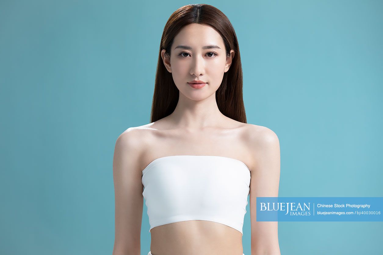 Studio shot of beautiful young Chinese woman