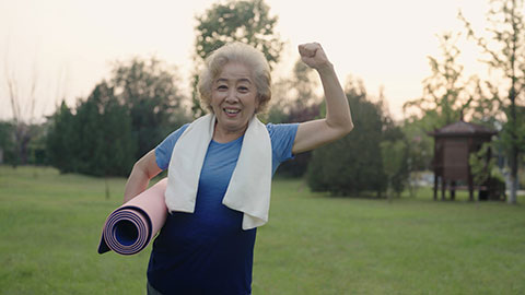 Happy senior Chinese woman exercising in park,4K