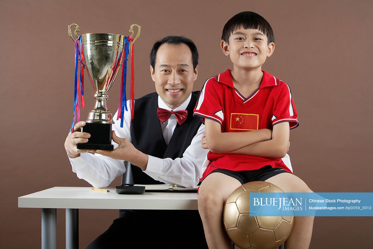 Father And Son Smiling, Father Holding Trophy