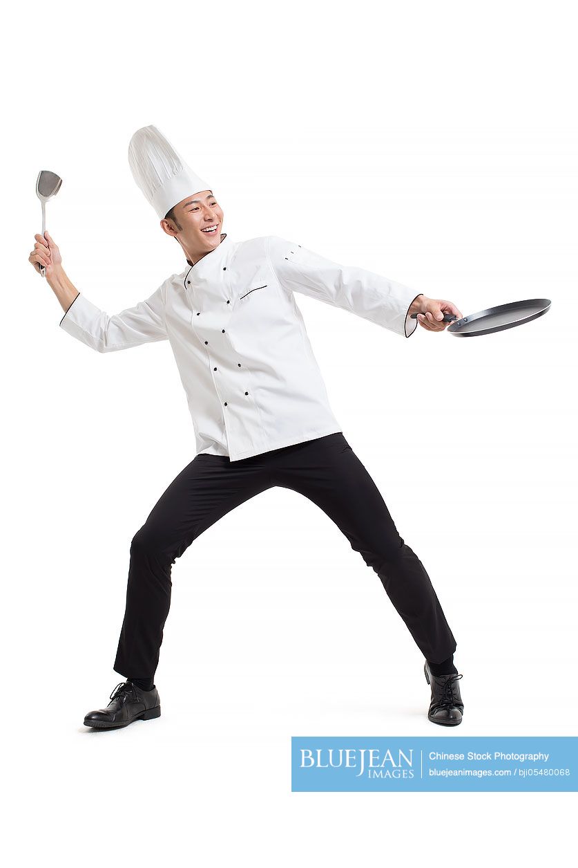 Cheerful Chinese chef cooking