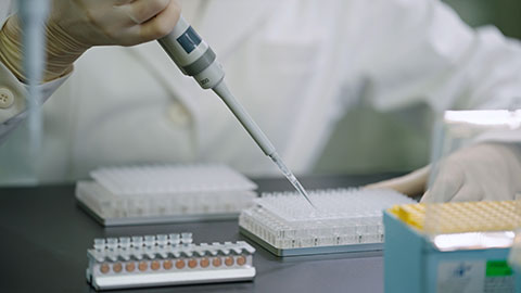 Chinese scientist pipetting samples in laboratory,4K
