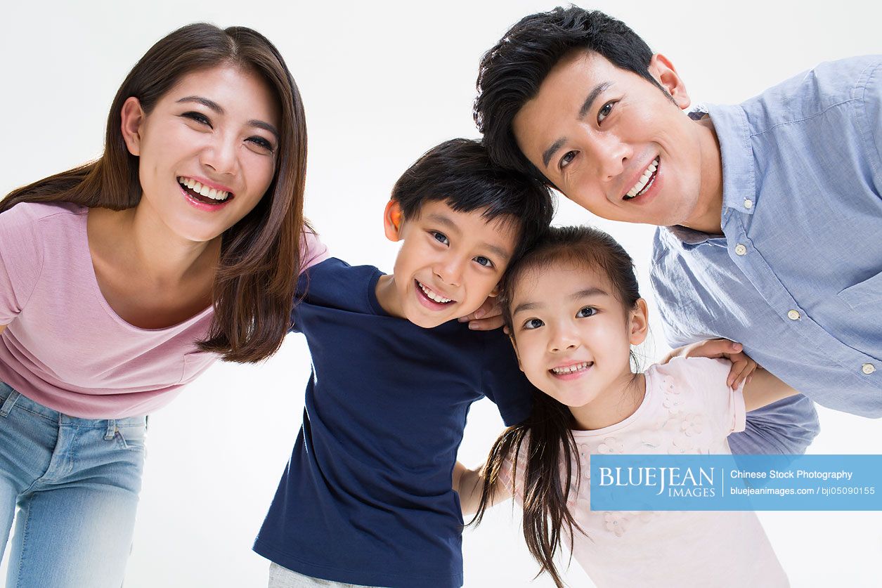 Portrait of cheerful young Chinese family