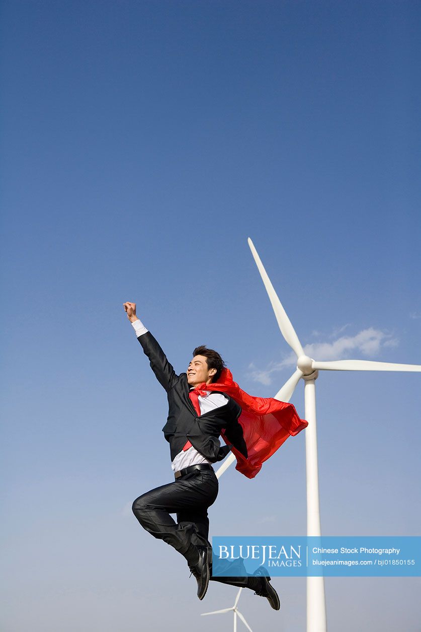 Chinese everyday hero in front of wind turbines