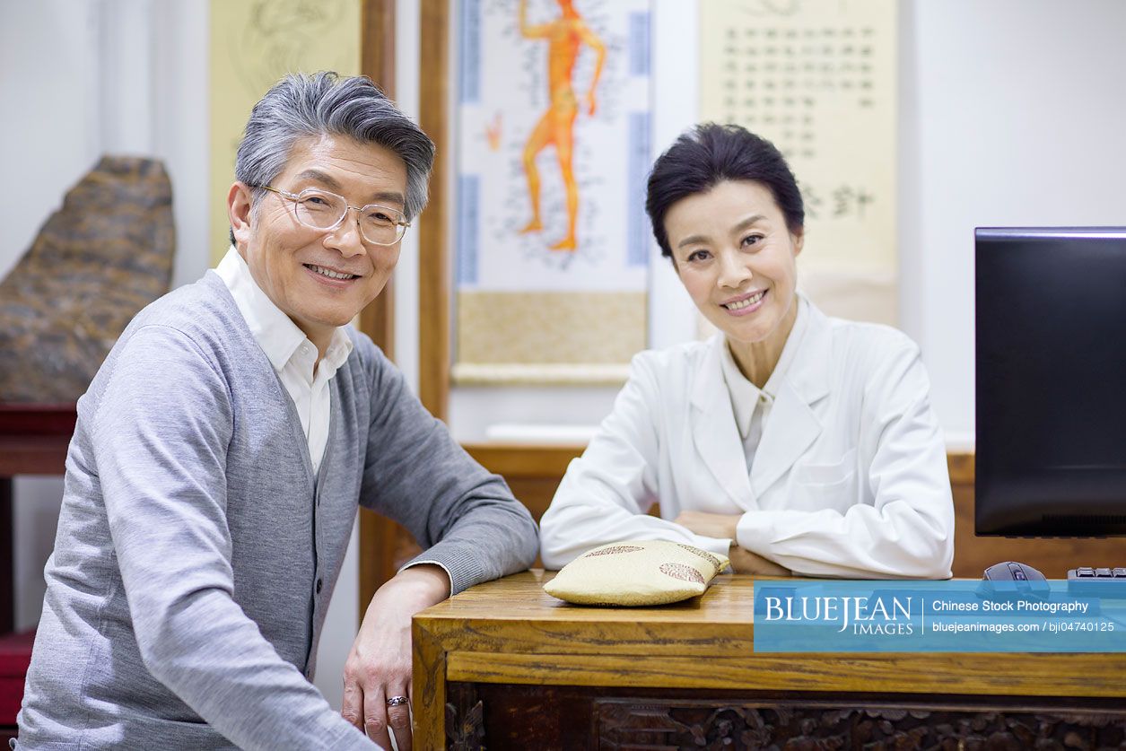 Female Chinese doctor and patient