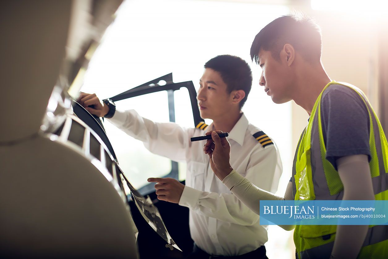 Chinese airplane mechanic checking helicopter