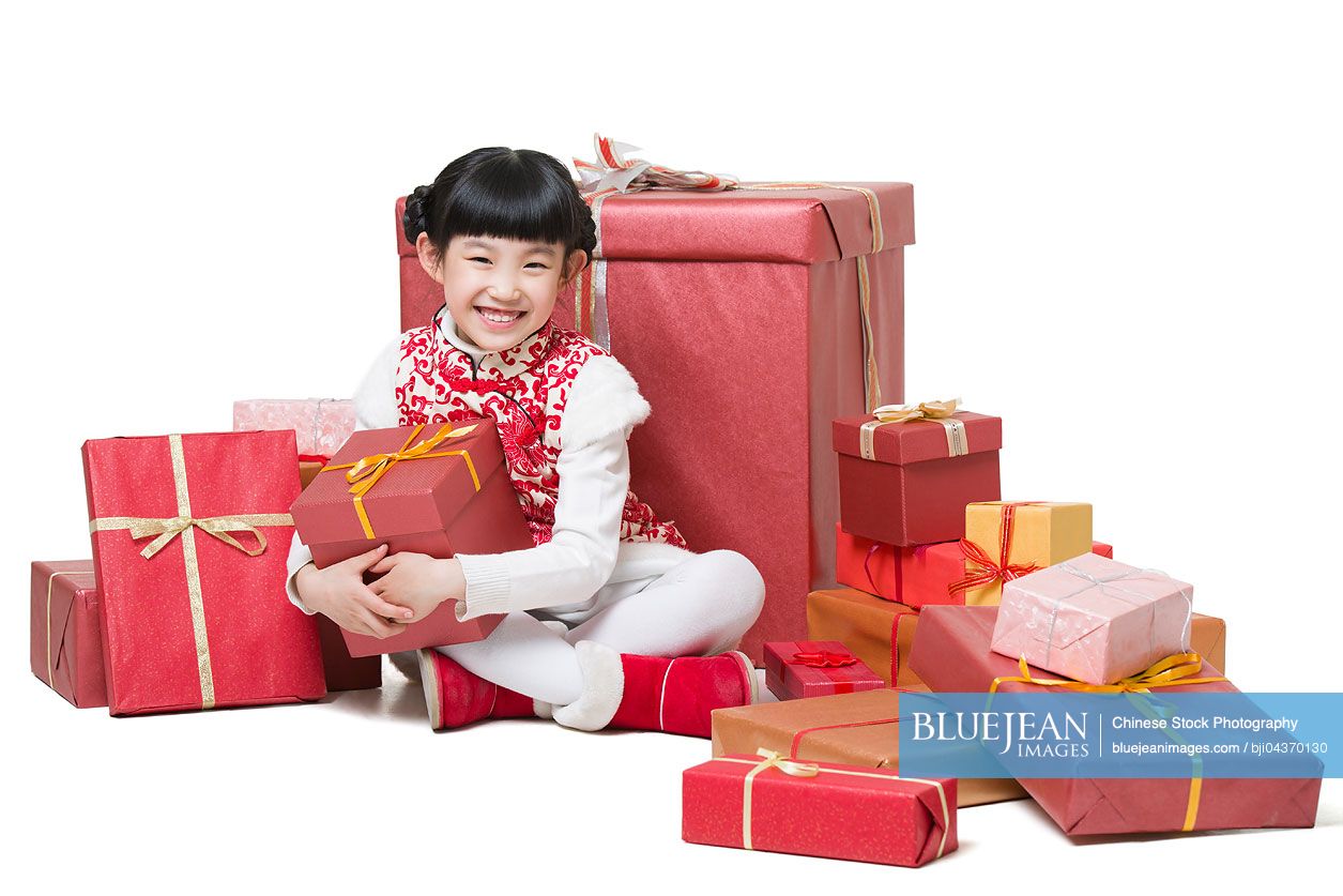 Happy girl receiving many Chinese new year gifts