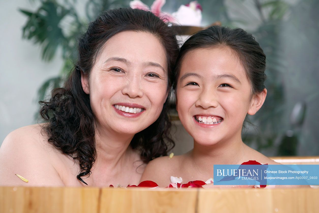 Chinese Woman And Young Girl Having A Spa Treatment Together