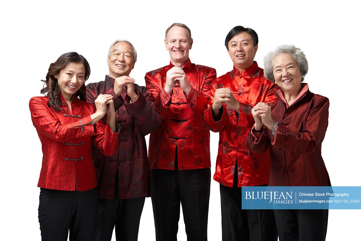 Friends and family make a gesture of greeting and good wishes for Chinese New Year