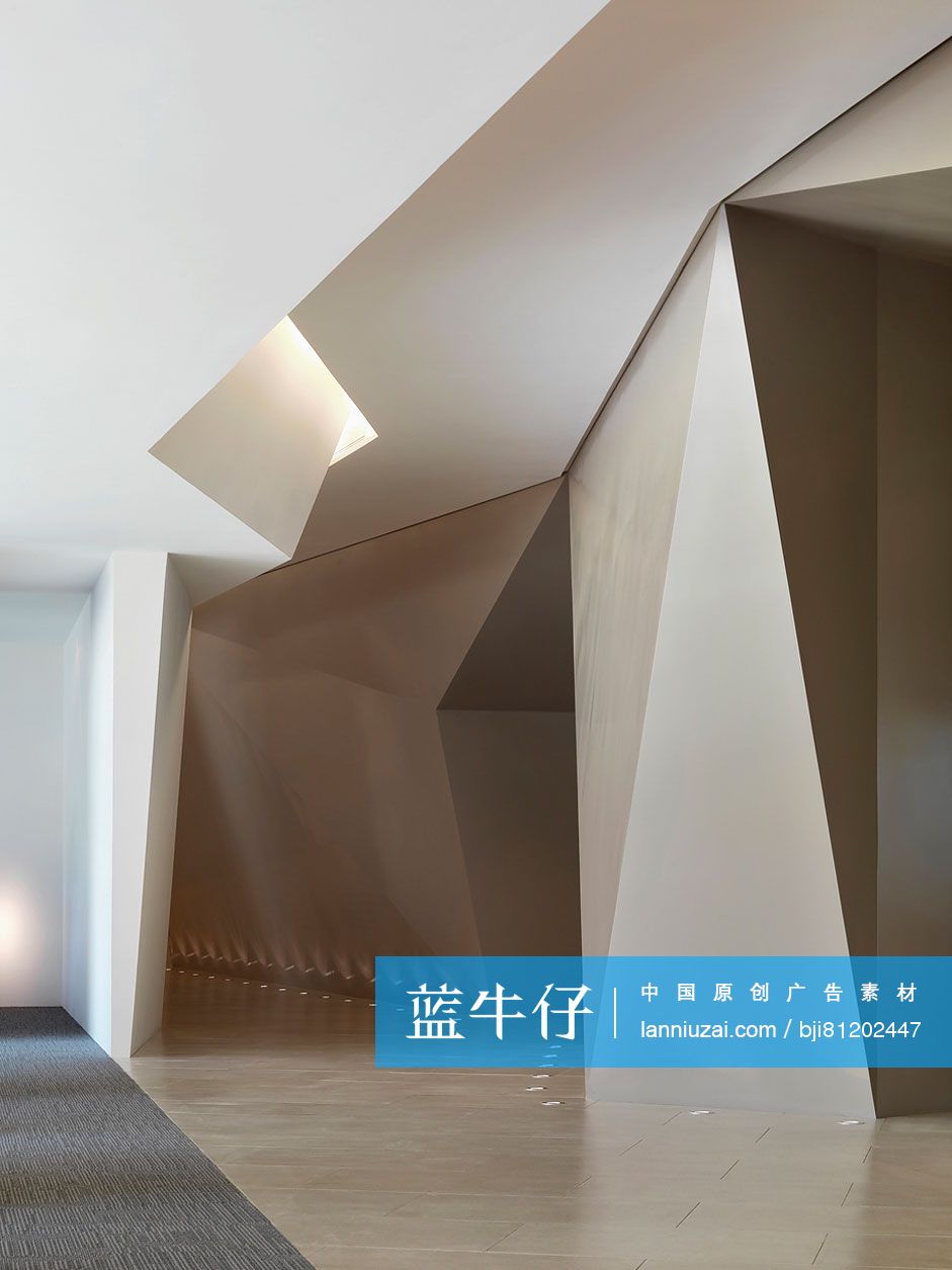 Architectural design and recessed lights along hallway in hotel