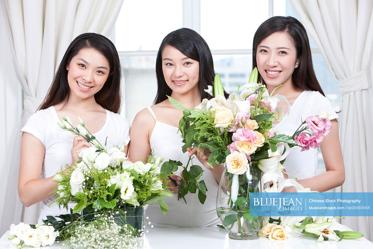 Best female Chinese friends arranging flowers together