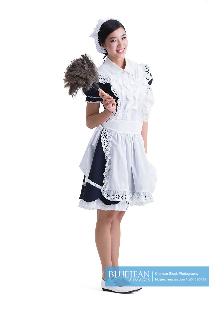 Young Chinese maid with silver duster in hand-High-res stock photo for  download