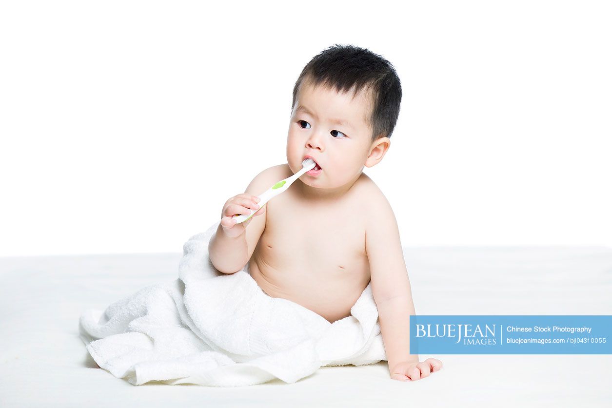 Cute Chinese baby brushing teeth