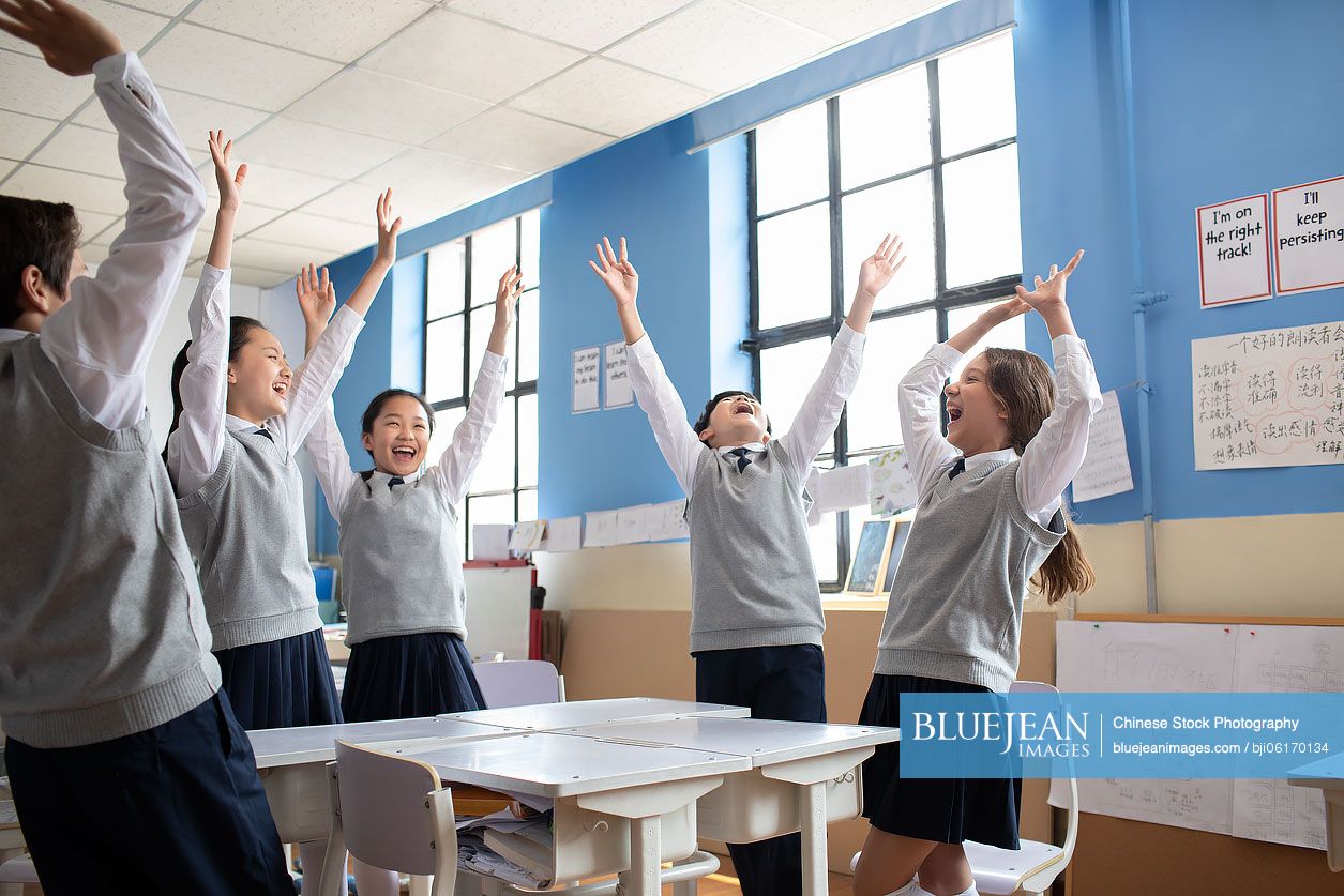 Classmates cheering in classroom