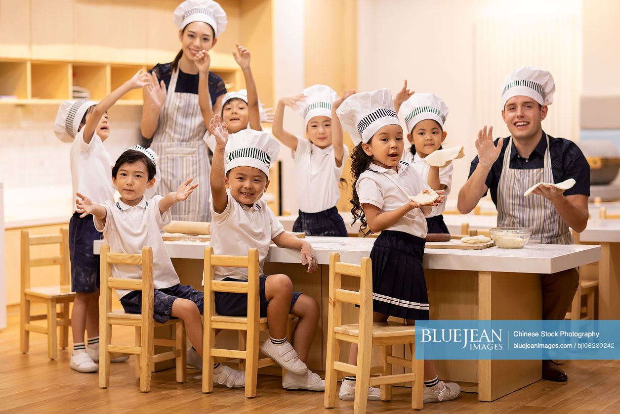 Children learning cooking in classroom