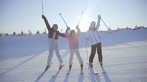 Happy young Chinese family relaxing in ski resort,4K