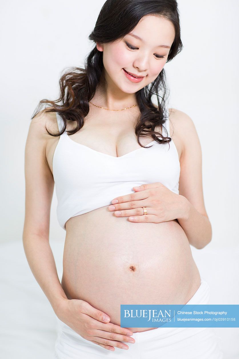 Happy pregnant Chinese woman